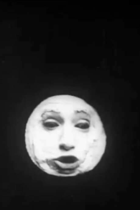 The piece appears to be a well‑known routine from Percy Honri’s musical‑theatre act. In the clip, Honri’s face emerges through a blacked‑out curtain, painted to resemble the man in the moon. He dons a hat and a puppet‑like costume, then begins to strum a ukulele as the performance unfolds.
